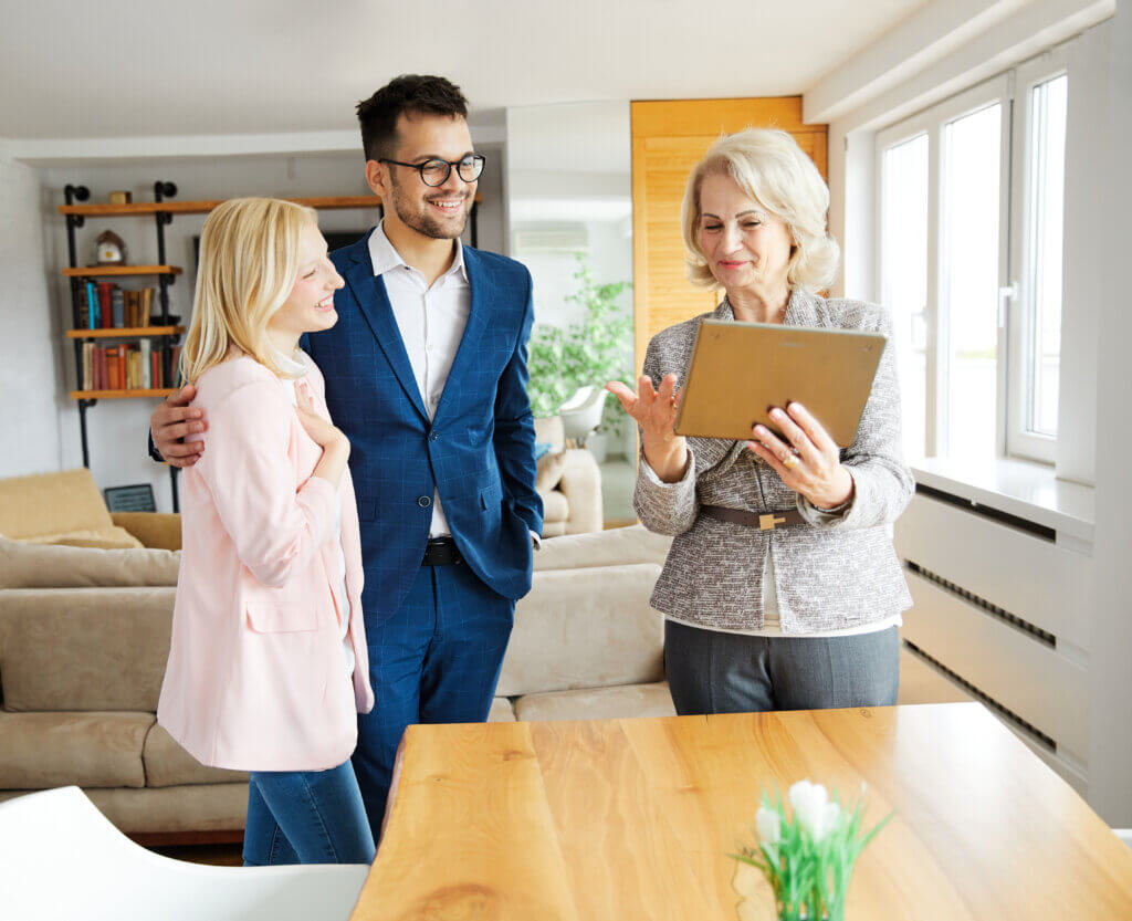 Couple talking to real estate agent